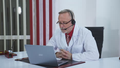doctor wear headset who is listening to patient and then talking about his symptom online. telemedicine concept
