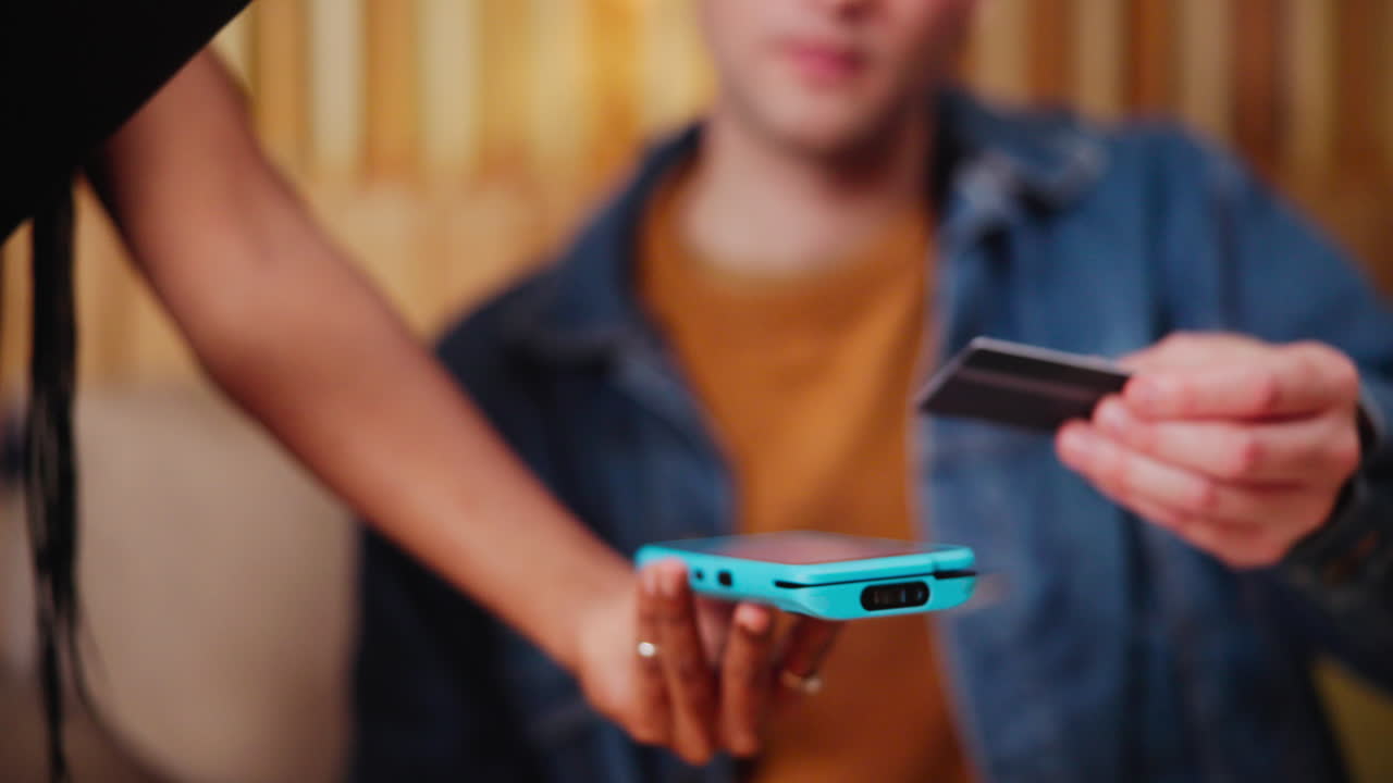 Person paying with credit card via mobile device