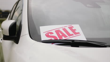 car sale sign on windshield