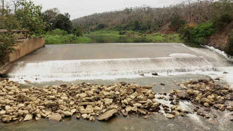 traveling front over a river, dam on a river in angola, africa 2