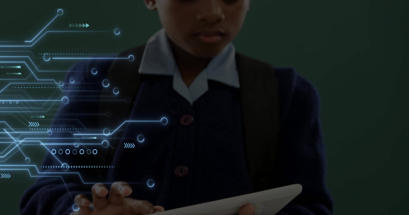 Girl tapping tablet initiating circuit graphics extending on green chalkboard for tech learning