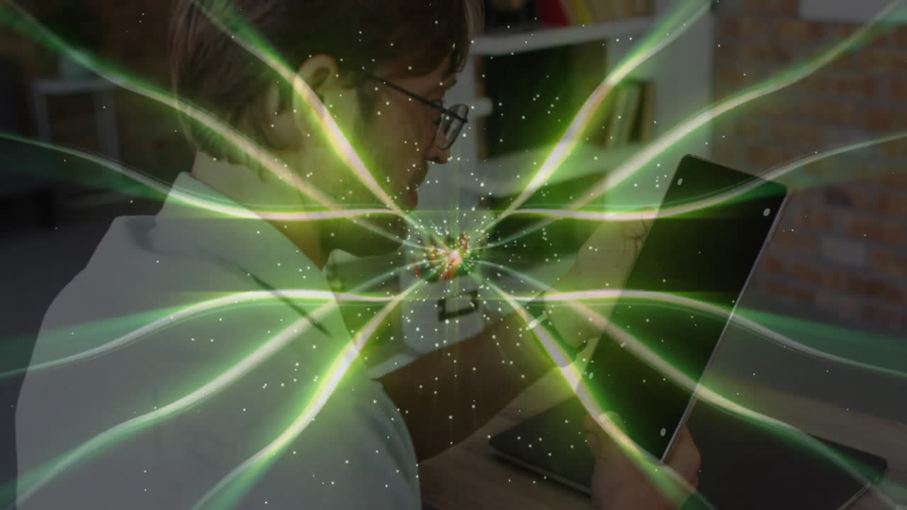 Green energy wave animation over person using tablet at home office