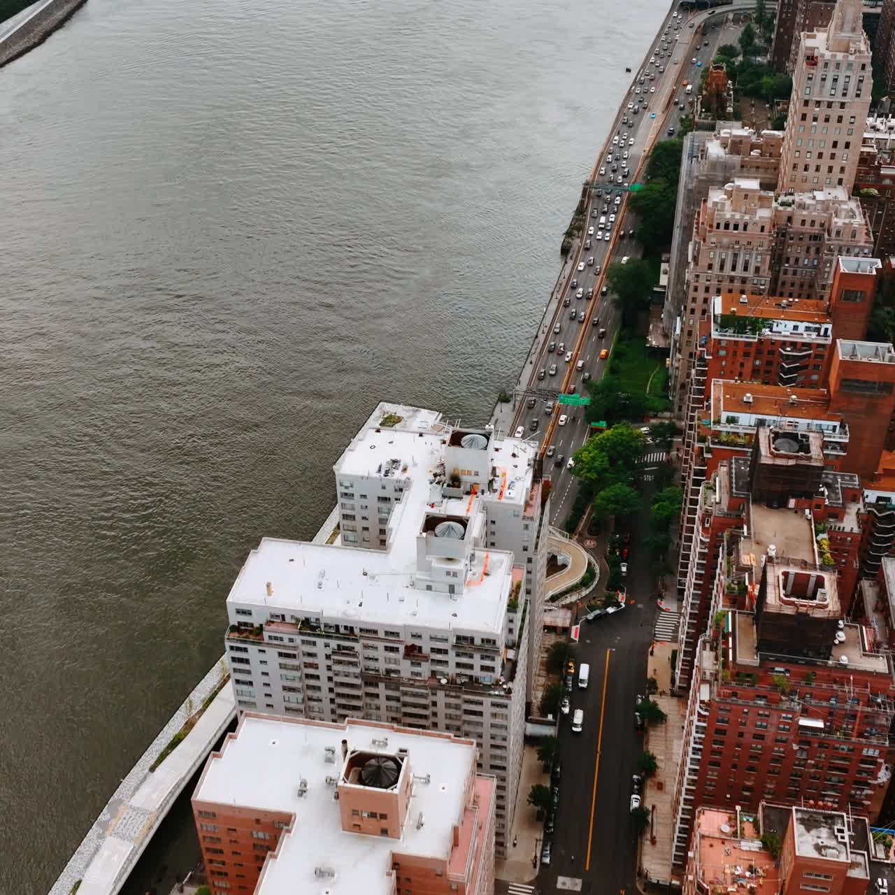 Traffic on the roads of New York at downtown. Top view of the waterfront of Hudson River