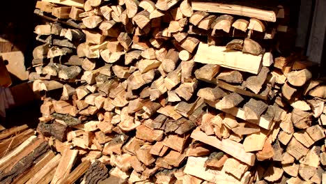 pile of wood cut for fireplace. wooden background.