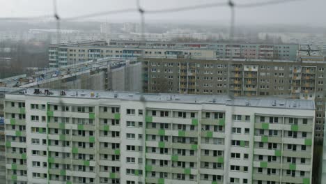 an old grey apartment building in an eastern suburb in berlin, germany