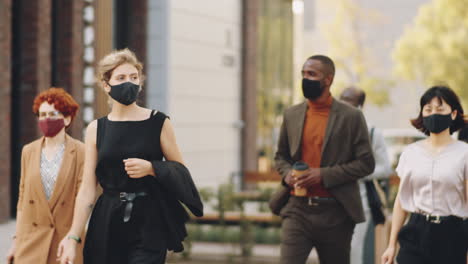 People-in-Masks-Walking-on-Street-in-City