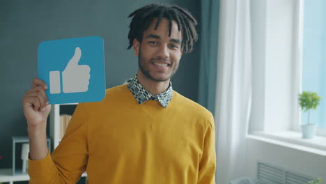 man holding social media reaction cards