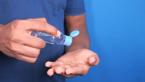 applying hand sanitizer