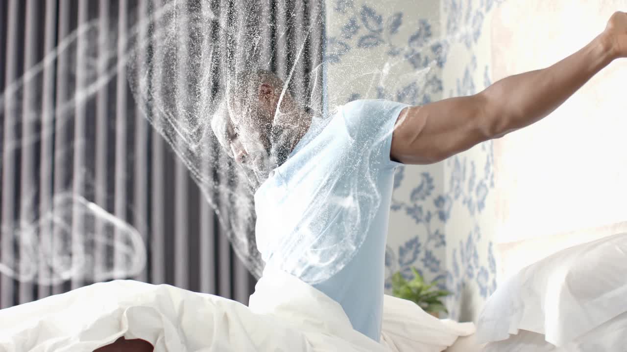 Man waking in bed, white swirl appearing, causing wrist checking, sitting, stretching for health