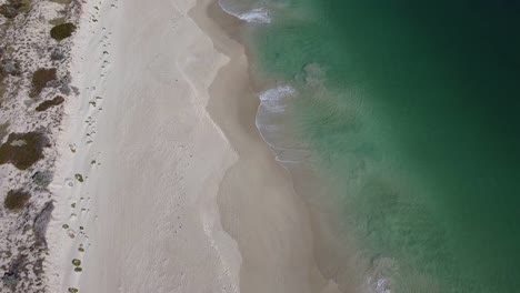 aerial birds eye view above turquoise waters of mindarie beach, perth