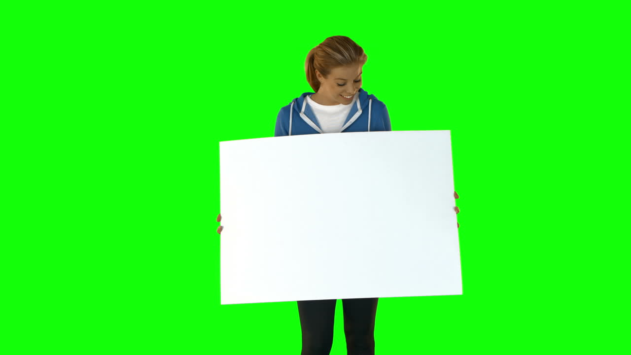 Smiling fit blonde showing poster