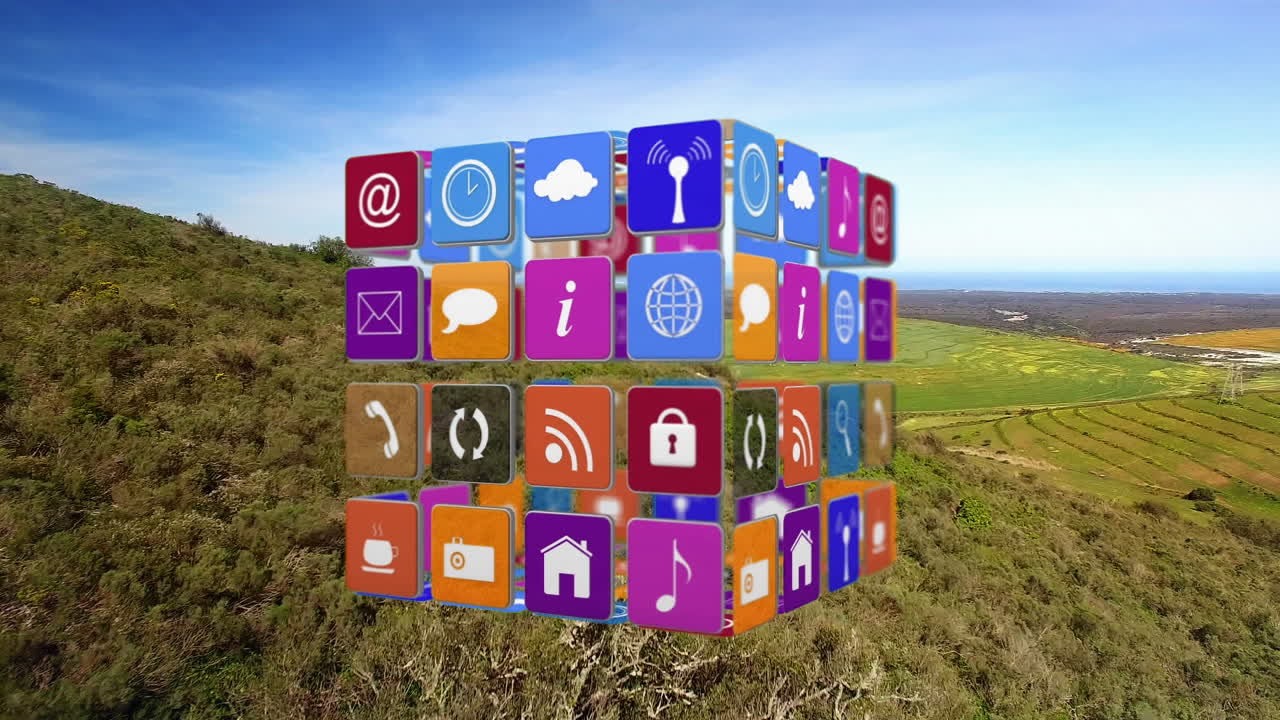 animación de un cubo con iconos digitales flotando sobre el paisaje