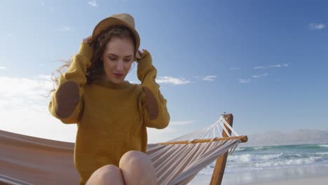 Woman-wearing-hat-at-beach-4k