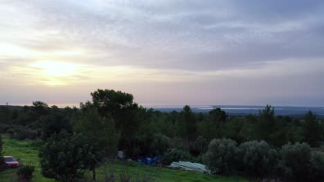 static aerial shot over a village revealing a beautiful horizon at naxos, greece