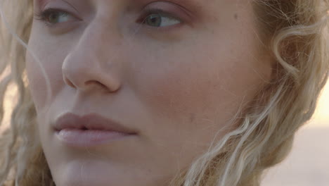 close-up-portrait-of-beautiful-blonde-woman-looking-confident-enjoying-relaxed-vacation-lifestyle-feeling-freedom-on-seaside-at-sunset