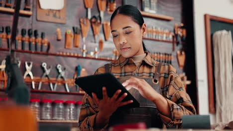 Leather-workshop,-woman-with-tablet