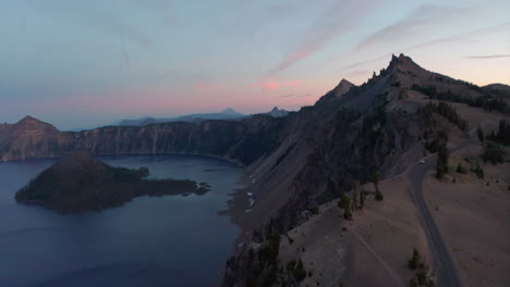 descending aerial shot over crater lake oregon at sunset
