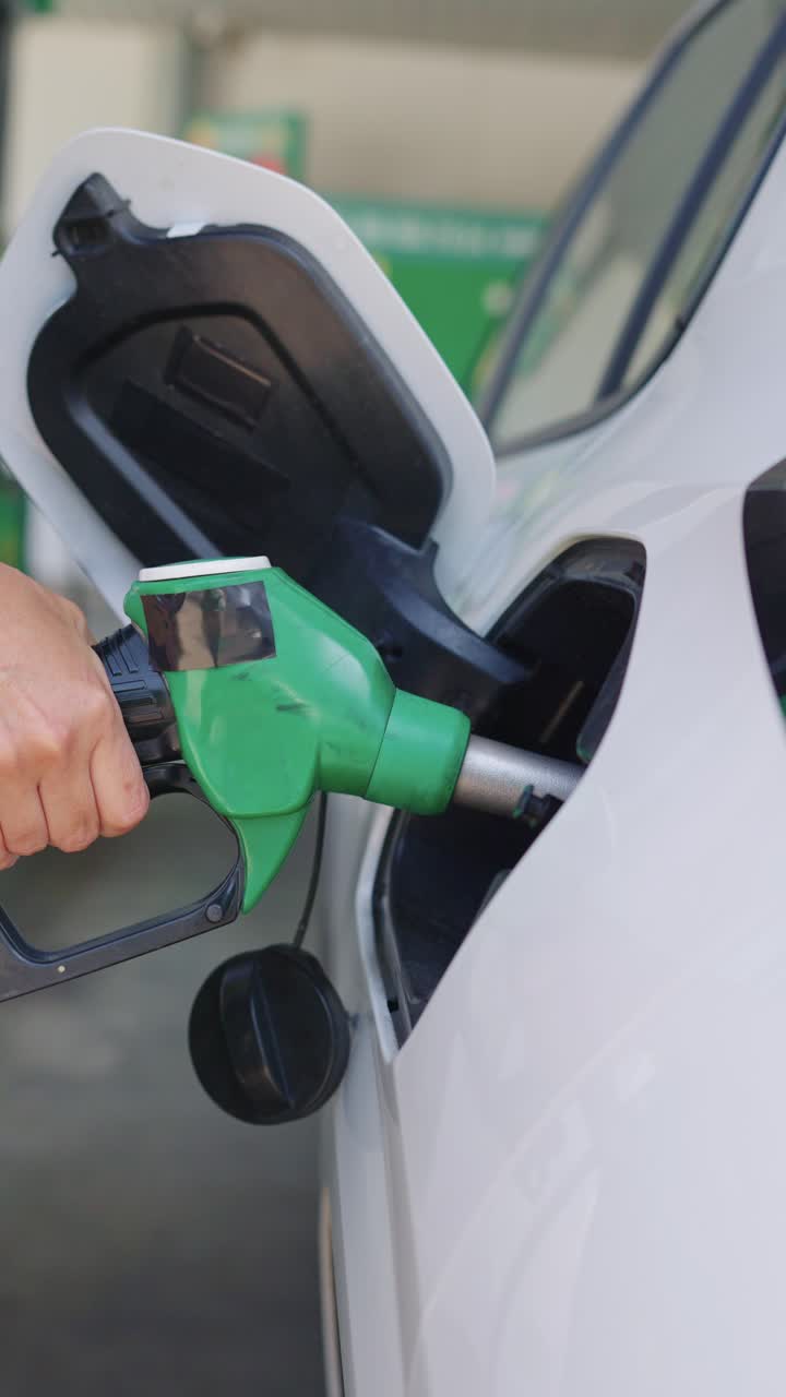 Refueling a car at a gas station