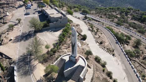 large statue of the virgin mary on mount cerro del cabeza sierra morena spain aerial