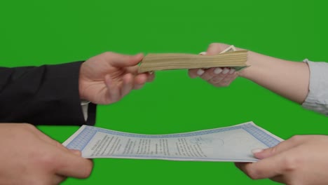 business deal exchange document for money, green screen, close-up