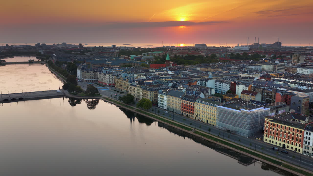Aerial drone view of The Lakes in Copenhagen, Denmark reflecting colourful dawn sky