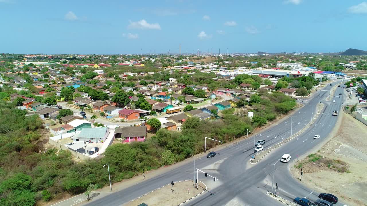 4k backwards reveal of Curacao houses with refinery in background