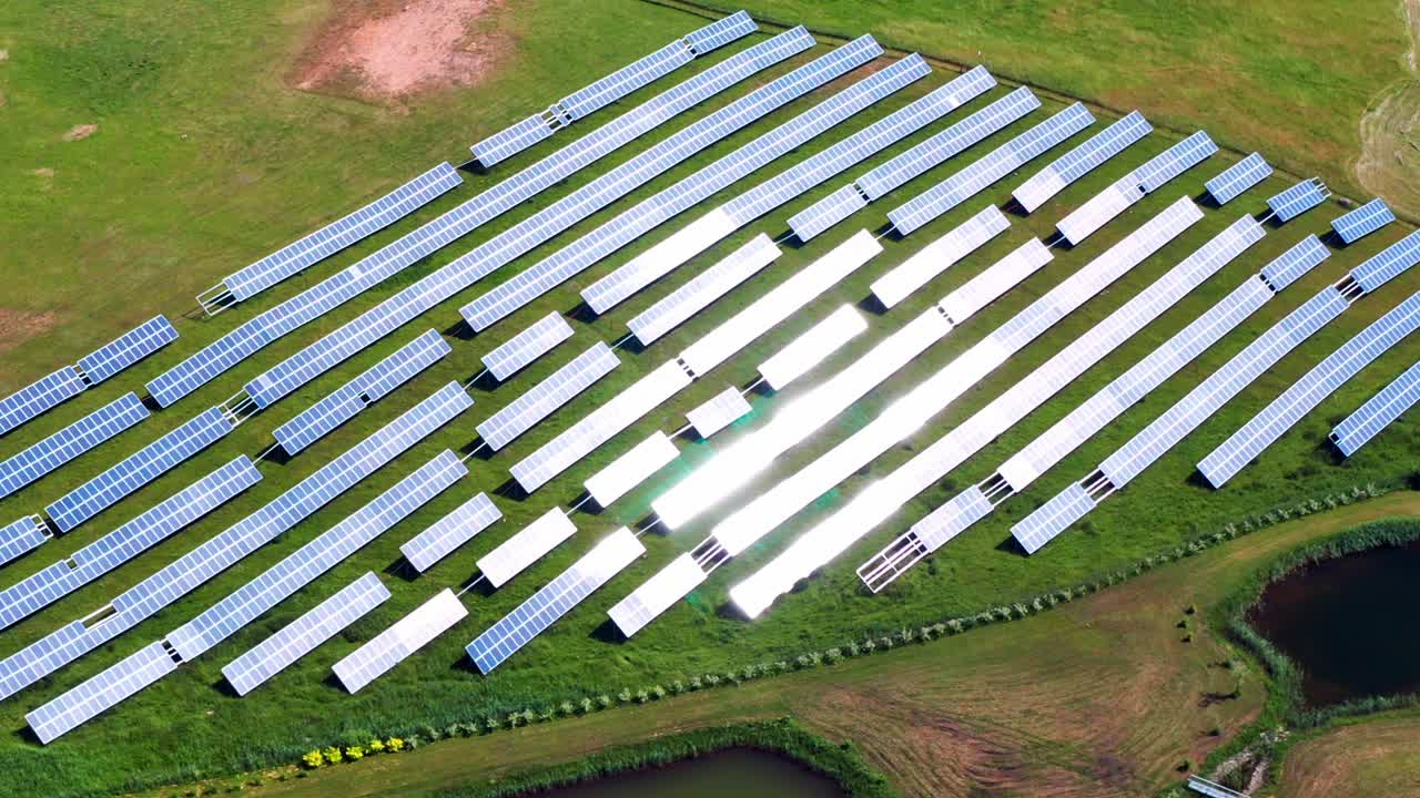 Solar Power Plant On Green Field Near Trakai, Lithuania - aerial drone shot