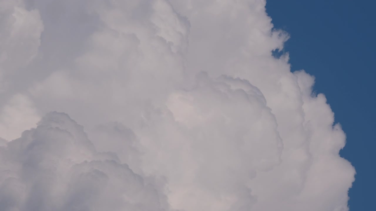 Time lapse of thick summer clouds developing into a storm