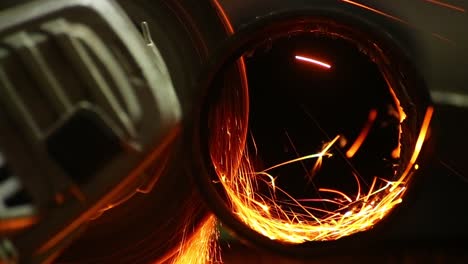 cutting a steel tube with angle grinder