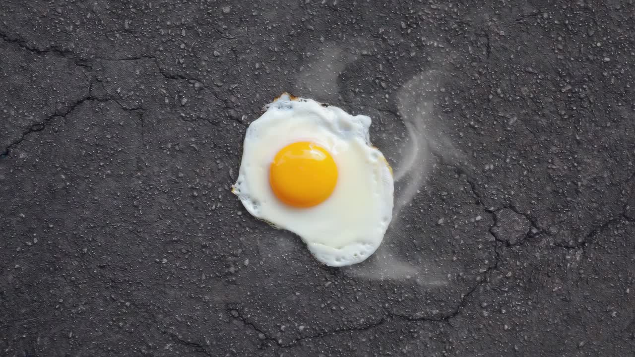 Fried egg on hot pavement