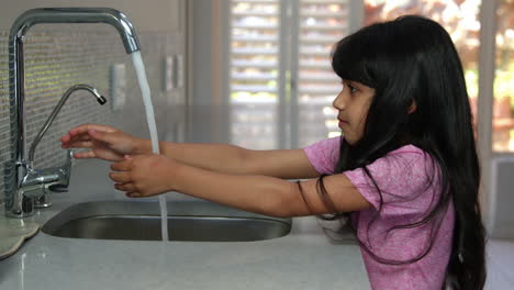 Cute-girl-washing-her-hands