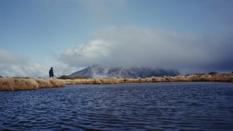 hiker at a mountain lake