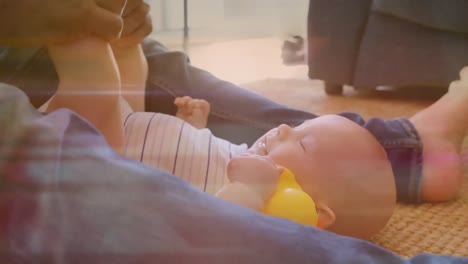 animación de rastros de luz sobre el padre caucásico y su hijo jugando juntos