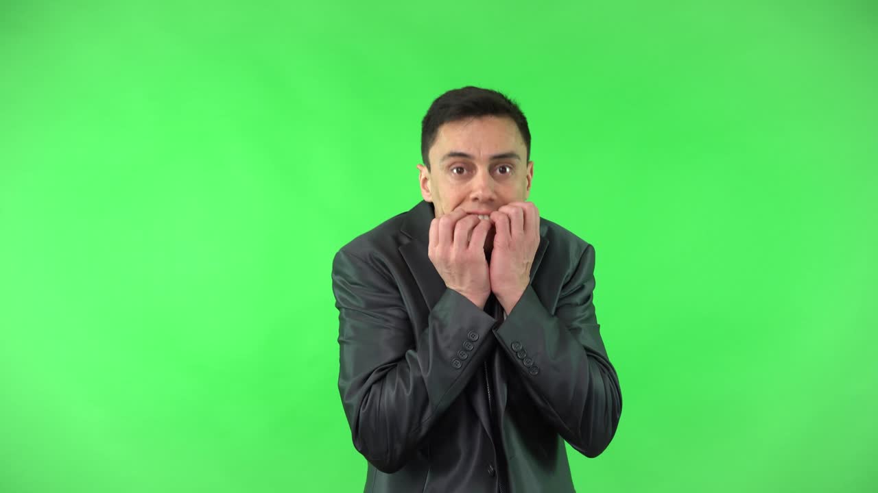 Man Expressing Worry, Anxiety, and Surprise on Green Screen