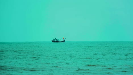 Anchored-Fishing-Trawler-Boat-Amidst-The-Indian-Ocean-Near-Bay-Of-Bengal-In-Kuakata,-Bangladesh