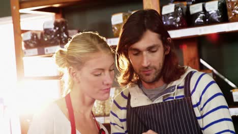 Staffs-using-digital-tablet-in-grocery-section