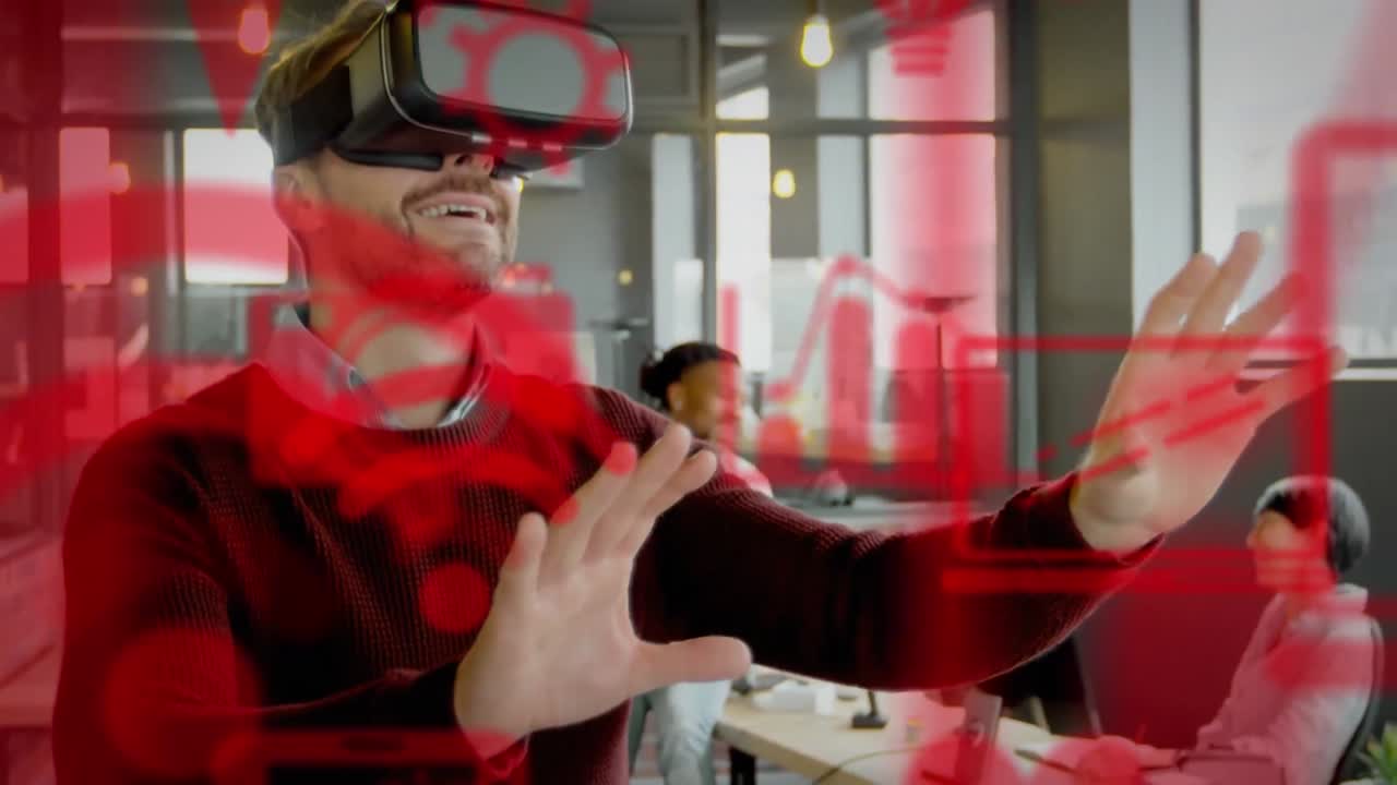 múltiples iconos digitales rojos flotando contra el hombre de negocios caucásico que usa auriculares vr en la oficina
