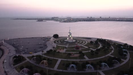 murjan island tower and city skyline with glowing lights, aerial view