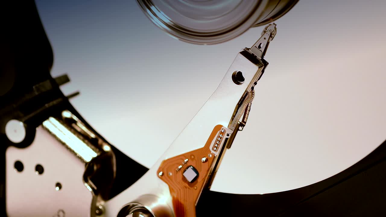 Hard Disk Drive, Close up of a hard disk drive reading and writing data.