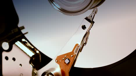 hard disk drive, close up of a hard disk drive reading and writing data.