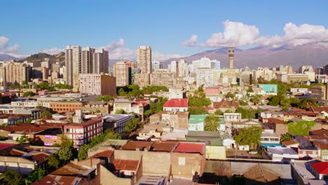 aerial drone panoramic shot, latin american valley town santiago de chile andean cordillera background