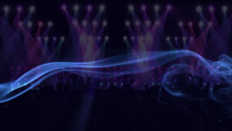 animation of smoke over light projections and spotlights on dancing crowd