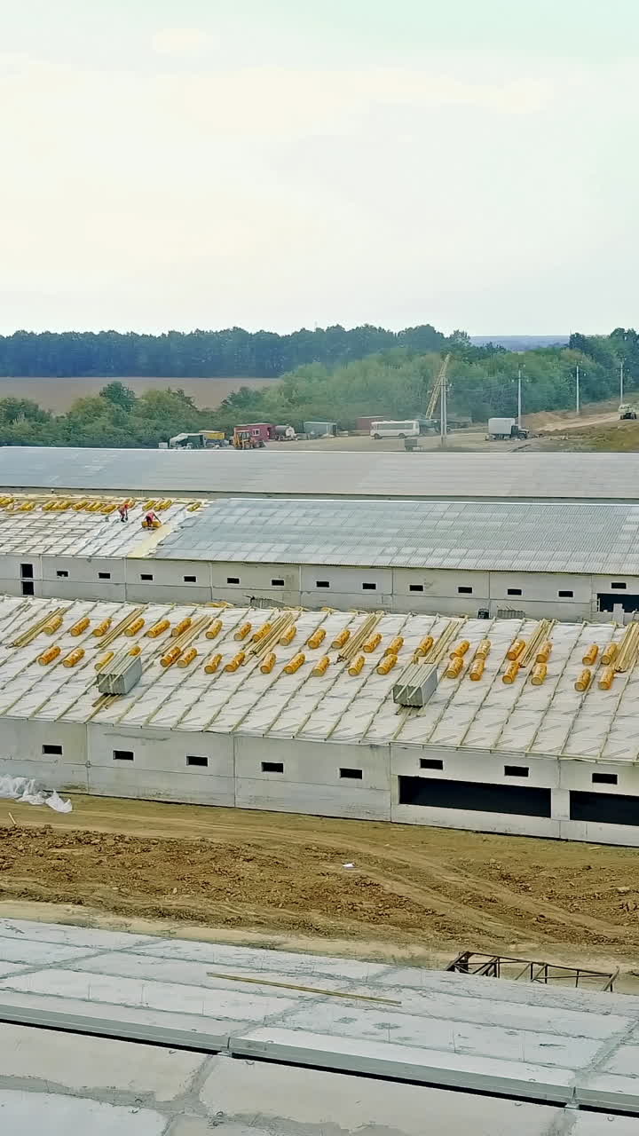 Constructing agriculture farm. Aerial view of construction site new farm for livestock in countryside