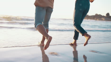 running, legs and couple at the beach