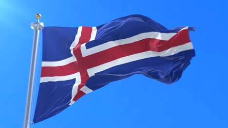 bandera de islandia ondeando en el viento con el cielo azul en lento, bucle