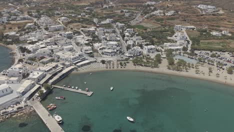 aerial orbit video of pollonia village in milos, greece d-log m profile professional video