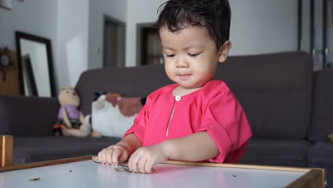 adorable boy exploring and having sensory motor activity while he is at home stock video