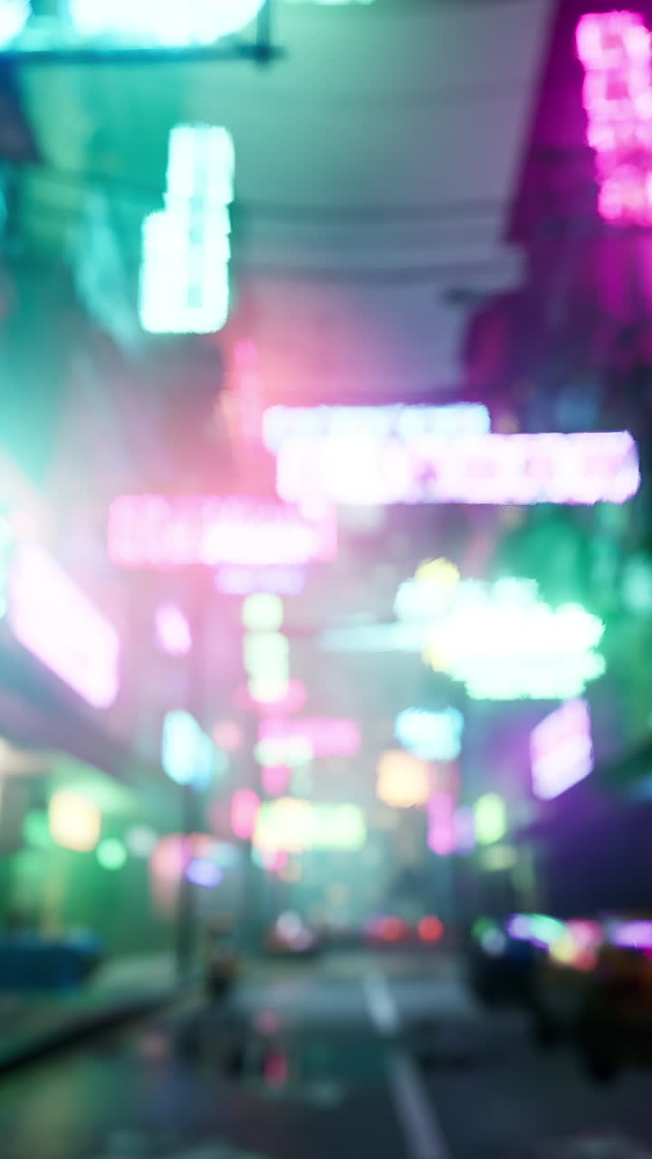 A blurry night scene of a city street with neon signs