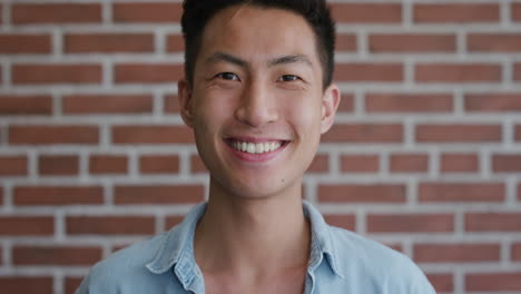 portrait-independent-young-asian-man-laughing-enjoying-success-looking-happy-confident-male-student-slow-motion