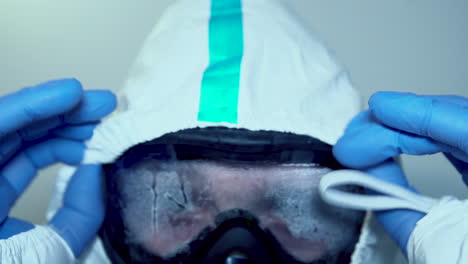 medical worker wearing sweaty protective goggles during coronavirus pandemic